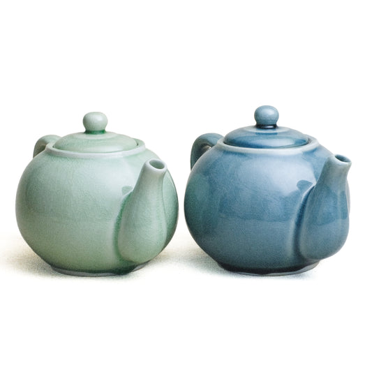 Pair of Tea Pots, round. Green Glaze and Blue Glaze, from left to right.