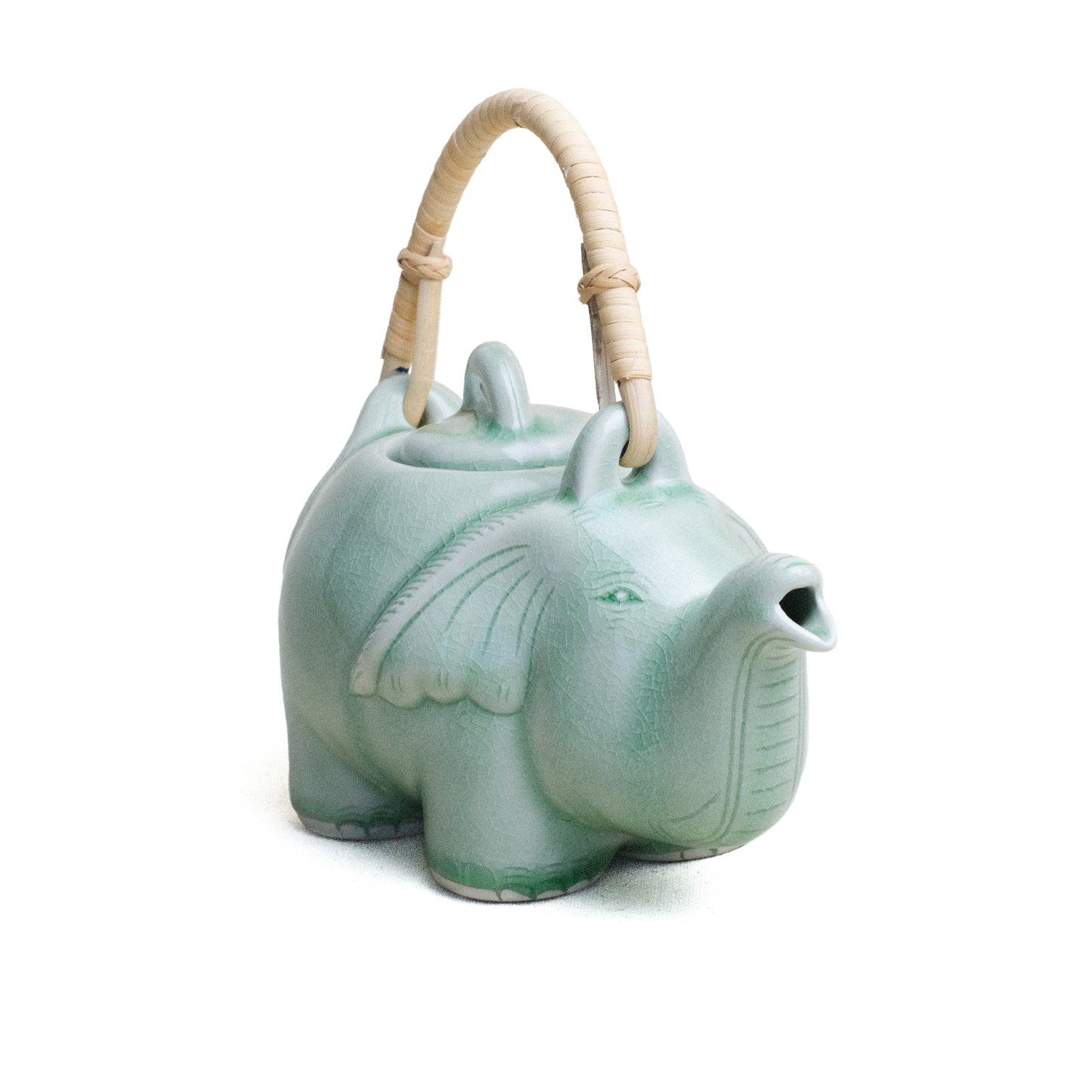 Tea Pot, Standing Elephant with Rattan Handle, Green Glaze. Frontal view.