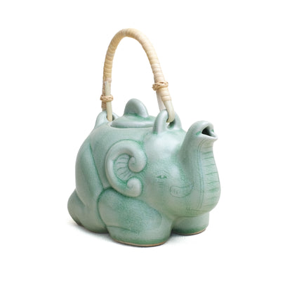 Tea Pot, Sitting Elephant with Rattan Handle, Green Glaze. Frontal view.